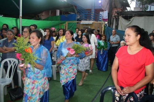 Catholic migrant workers from the Philippines attend Mass outside the Community of St. Therese of Lisieux chapel in Rehovot