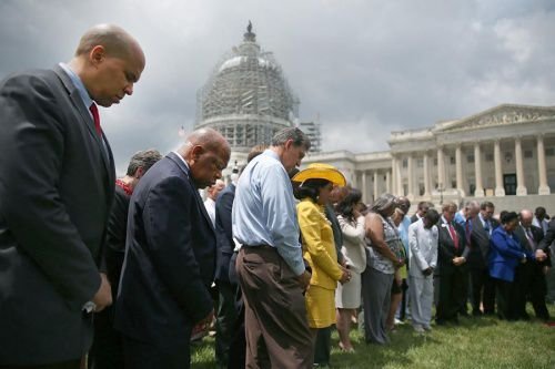 Members of Congress hold a prayer circle for Charleston shooting victims outside the White House