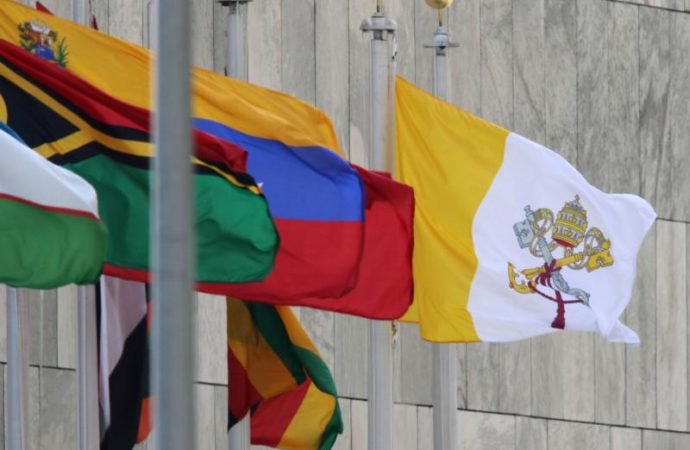 The Vatican flag flies with the flags of nations outside the U.N. headquarters in New York. (Bob Roller/CNS via Crux)