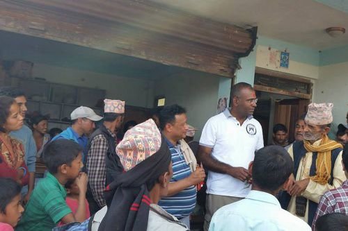 Fr. Augustine and associates distribute relieft supplies following the April 25 Nepali earthquake. Credit: Fr. Vijay Toppo