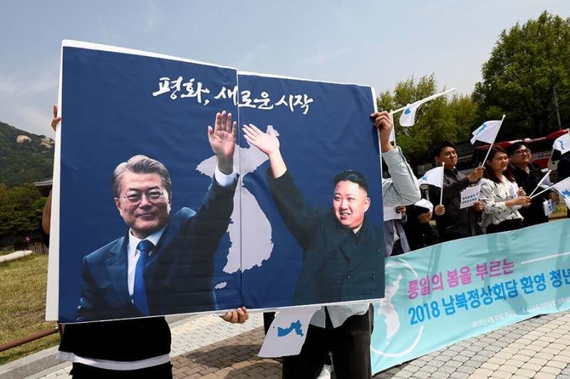 Posters of South Korean President Moon Jae-In and North Korean leader Kim Jong-Un during a rally on April 26
