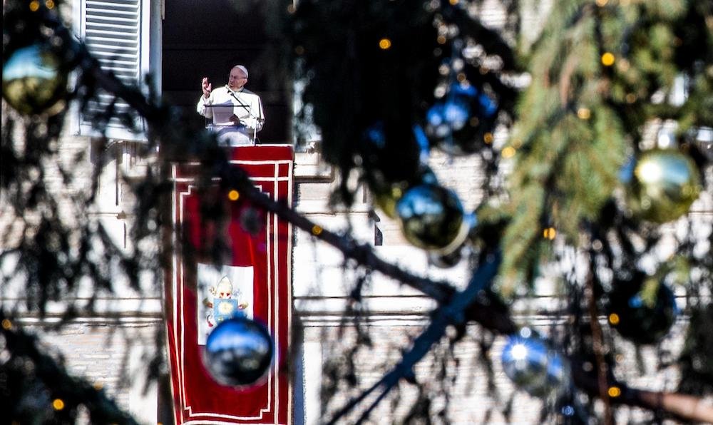 Pope Francis leads the Angelus from the window of his studio overlooking St. Peter's Square at the Vatican Dec. 26. (CNS photo/Claudio Peri