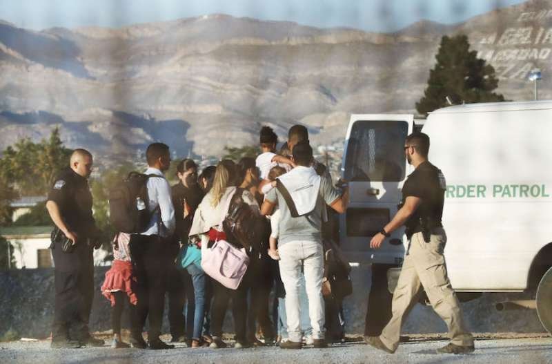 Migrants are detained north of the U.S. border. Credit: Mario Tama/Getty Images.