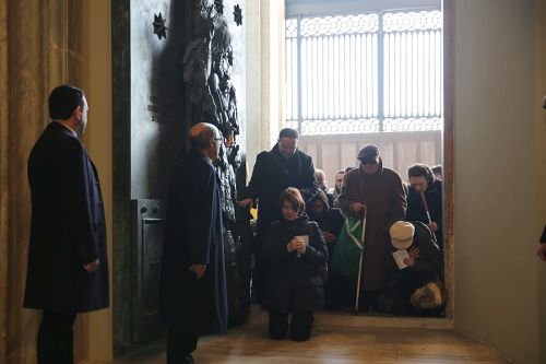 Pilgrims pass through the Holy Doors of the Archbasilica of St. John Lateran in Rome