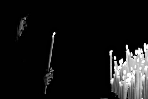 Praying. Credit: Luca Cerini via Flickr (CC BY-NC-ND 2.0).