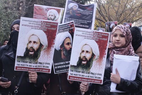 Members of Shia Muslim community of Greece hold posters of Sheikh Nimr al-Nimr during a protest rally outside of Saudi Arabia's embassy on January 6. 2016. (Photo by Milos Bicanski/Getty Images)