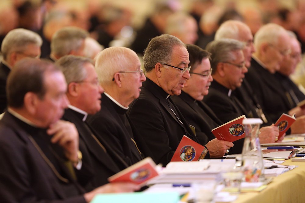 Prelates pray during the 2017 fall general assembly of the U.S. Conference of Catholic Bishops in Baltimore. Discussion and voting on concrete measures to address the abuse crisis and a day of spiritual discernment and prayer will top the agenda for the U.S. bishops when they meet Nov. 12-14 in Baltimore. (CNS photo/Bob Roller)