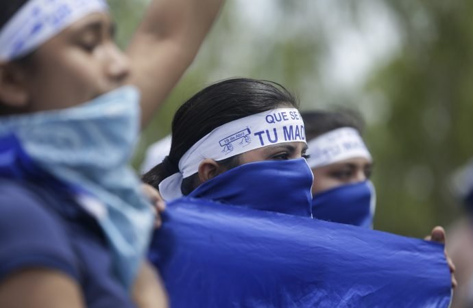 A protestor holds a homemade mortar during a demonstration supporting journalists recently attacked while covering protests demanding the resignation of President Daniel Ortega and the release of all political prisoners