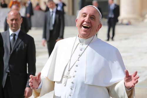 Pope Francis laughing outside of St. Peter's Basilica during the general audience on April 1
