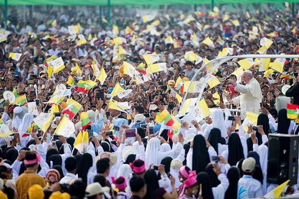 Pope Francis is greeted by crowds as he prepares to say Mass in Yangon