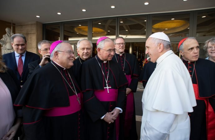 Pope Francis talks with U.S. bishops after a session of the Synod of Bishops on young people