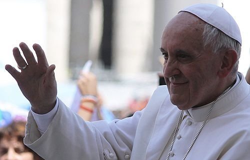 Pope Francis rides through St. Peter's Square before his Wednesday General Audience