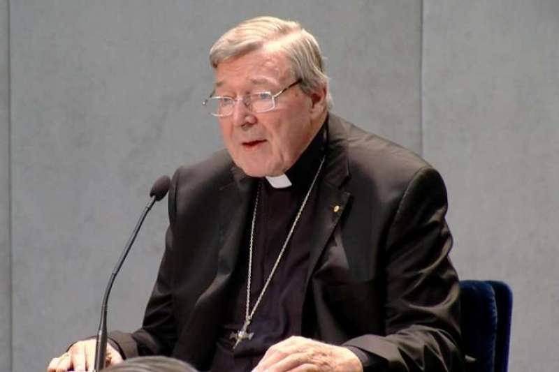 Cardinal George Pell speaks with journalists