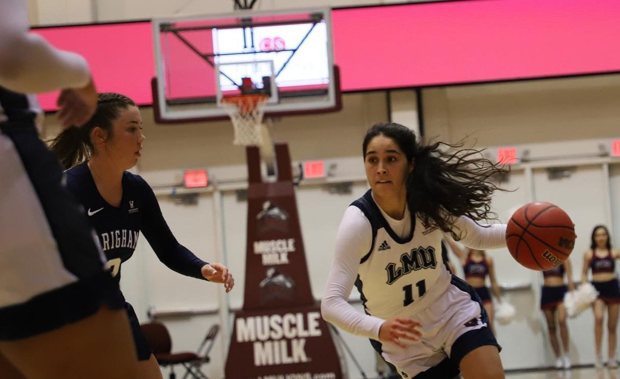 Former Mater Dei HS star Andee Velasco (11) dribbles toward the basket in LMU’s 83-57 win over San Diego Feb. 2 at Gersten Pavilion. (LMU ATHLETICS)
