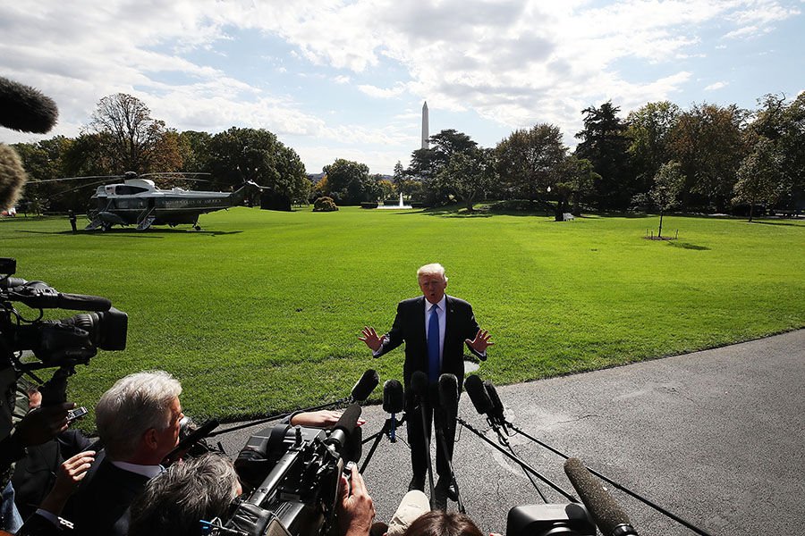 President Donald Trump speaks to reporters before boarding Marine One to depart from the White House Oct. 25. This week Kathryn Jean Lopez looks back on the first year since Trump was elected president. (MARK WILSON/GETTY IMAGES)