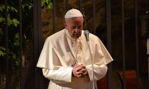 Pope Francis prays in the Lourdes Grotto of the Vatican Gardens on May 31