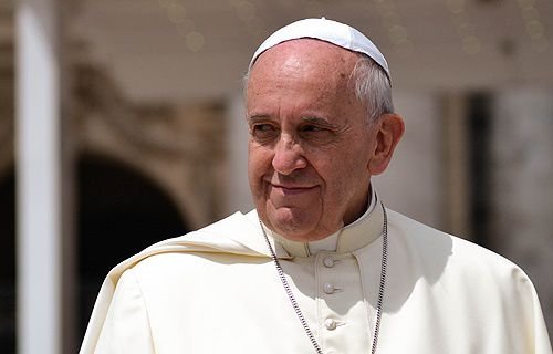 Pope Francis greets pilgrims in St. Peter's Square during the Wednesday general audience on May 28