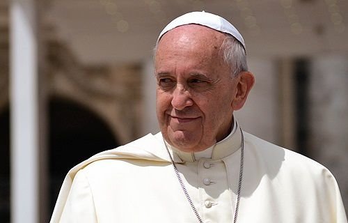 Pope Francis greets pilgrims in St. Peter's Square during the Wednesday general audience May 28