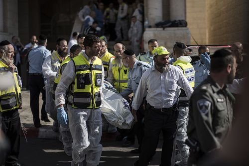 Israeli emergency personnel remove body of an Israeli man killed in a synagogue in Jerusalem on Nov. 18