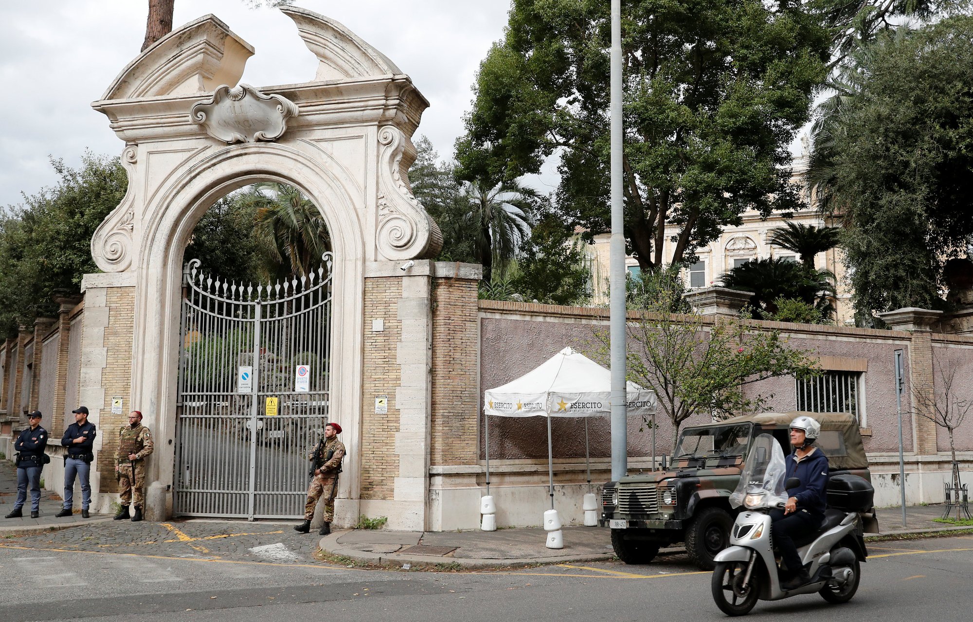 Italian Army and police officers stand in front of the apostolic nunciature to Italy in Rome where workers discovered human bones during a reconstruction project. (CATHOLIC NEWS SERVICE PHOTO/STEFANO RELLANDINI