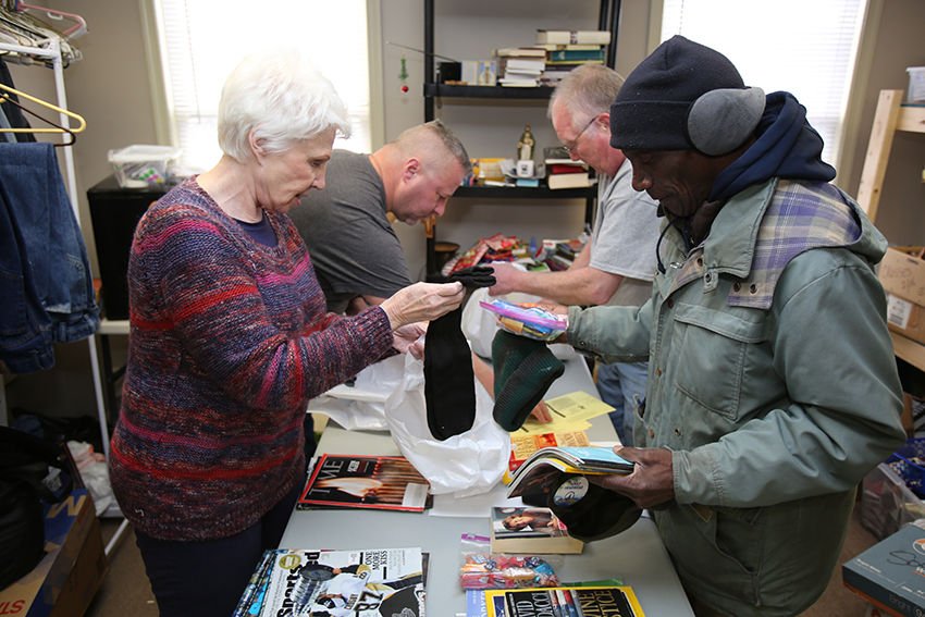 Volunteers of the Apostleship of the Sea for the Archdiocese of Baltimore pack supplies Jan. 10 for the crew of the Newlead Granadino
