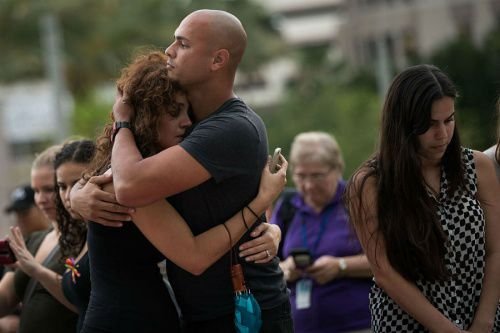 Mourners at a memorial for the victims of the Orlando shooting. Credit: Drew Angerer / Getty Images News.