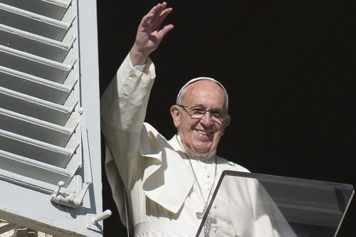 Pope Francis waves during the Angelus address in St. Peter's Square on November 22
