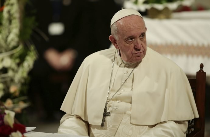 Pope Francis sits during a meeting with Catholic priests and other Christian representatives in the cathedral of the capital