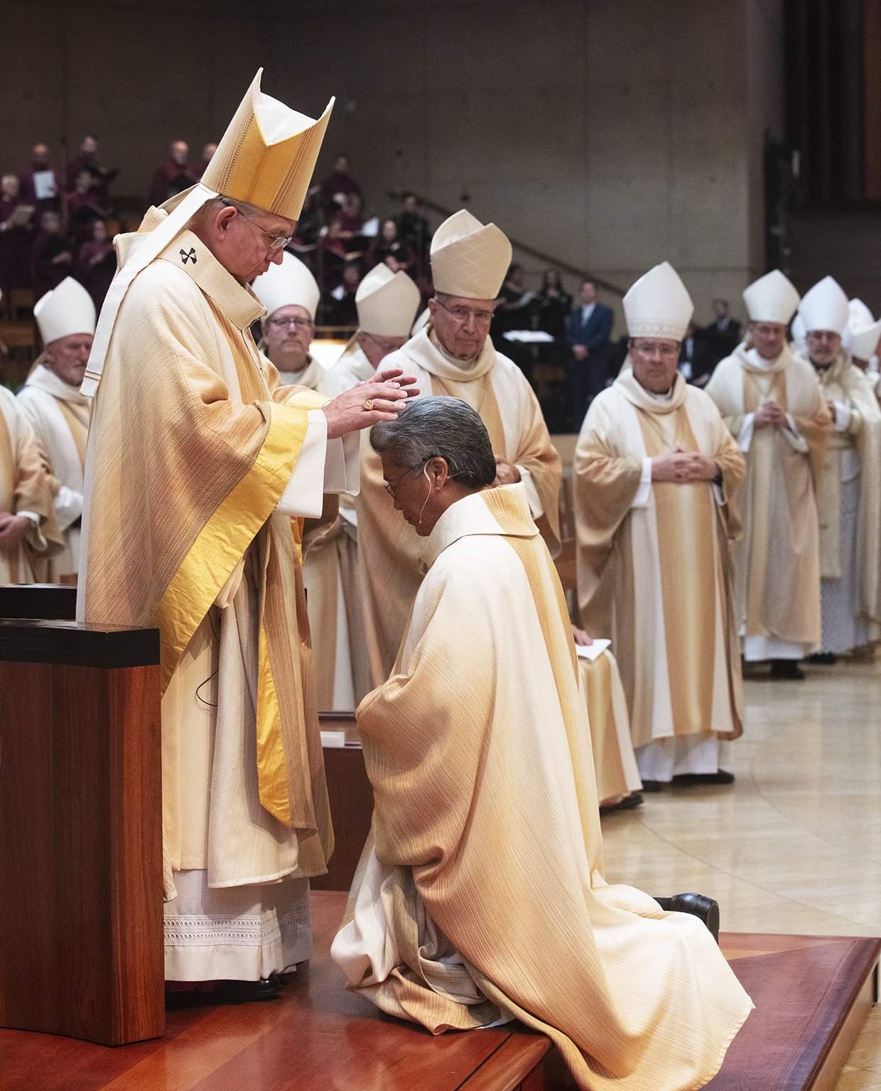 Archbishop Gomez lays his hands on Bishop Alex Aclan at his episcopal ordination Mass May 16