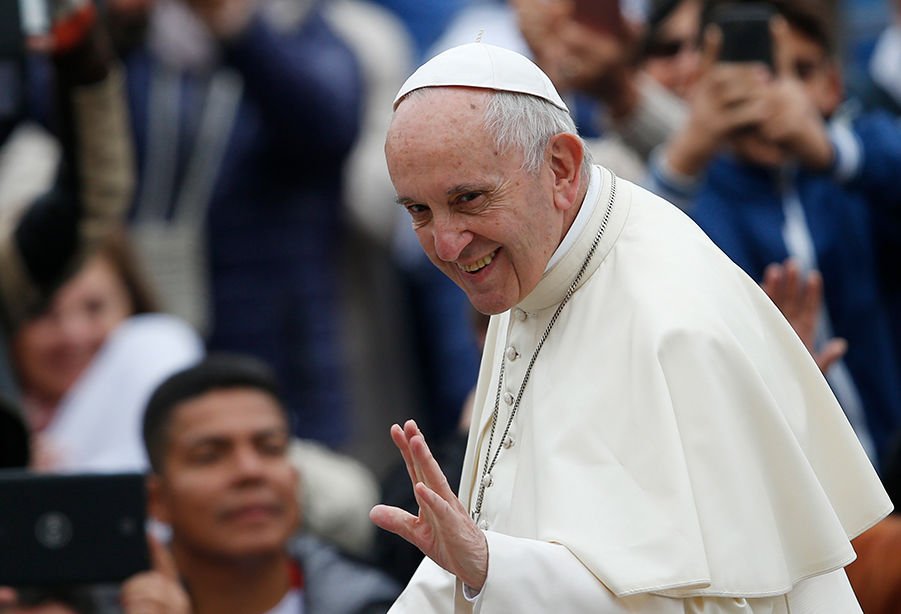 Pope Francis greets the crowd during his general audience in St. Peter’s Square at the Vatican Oct. 18. (CNS PHOTO/PAUL HARING)