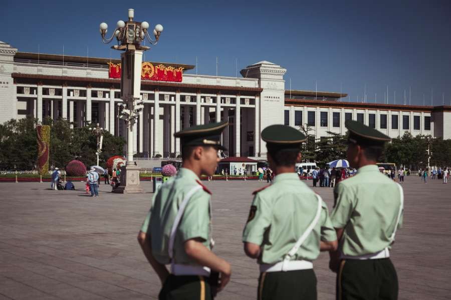 Chinese officers patrolling Tiananmen Square May 2013 in China (Credit: Alexandre Kuma via Flickr/CC)