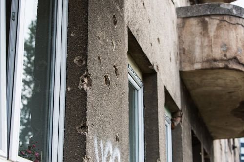 Buildings in Sarajevo still bear the scars of the 1992-1995 Bosnian War. Credit: Andreas Duren/CNA.