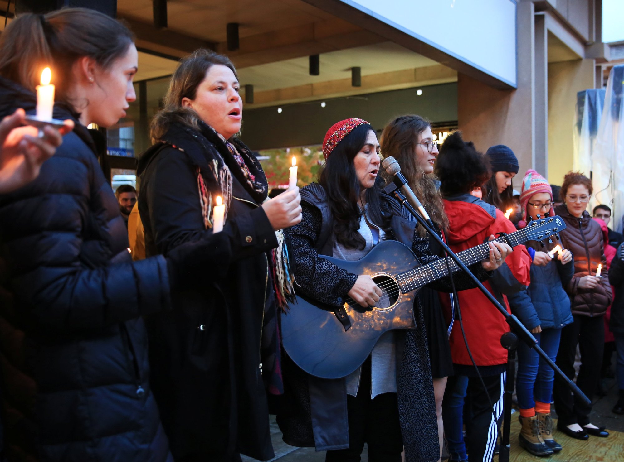 People mourn the loss of life as they hold a vigil for the victims of the Tree of Life Synagogue shooting in Pittsburgh Oct. 27. (CNS PHOTO/JOHN ALTDORFER