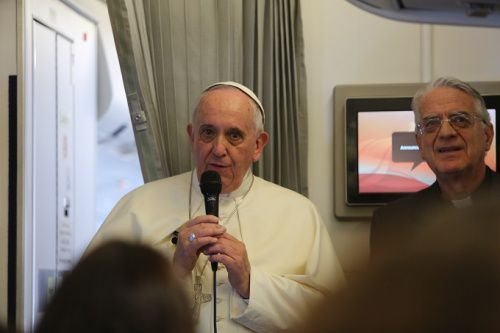 Pope Francis speaks to journalists on his flight from Sri Lanka to the Philippines on Jan. 15