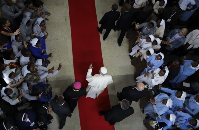 Pope Francis arrives for a meeting at the Cathedral of the Immaculate Conception