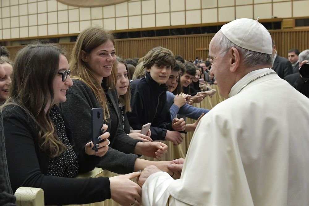 Pope Francis greets people during an audience with students and staff from Ennio Quirino Visconti Lyceum-Gymnasium
