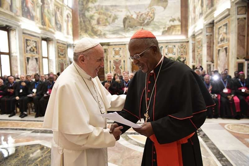 Pope Francis greets Cardinal John Njue of Nairobi