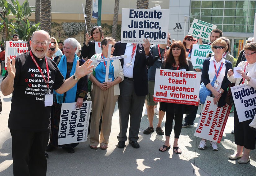Father Chris Ponnet leads a demonstration against the death penalty Feb. 27 as part of the Los Angeles Religious Education Congress in Anaheim