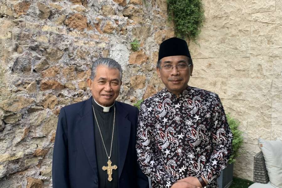 Sheikh Yahya Cholil Staquf with Archbishop Agustinus Agus of Pontianak. (Courtney Grogan/CNA)