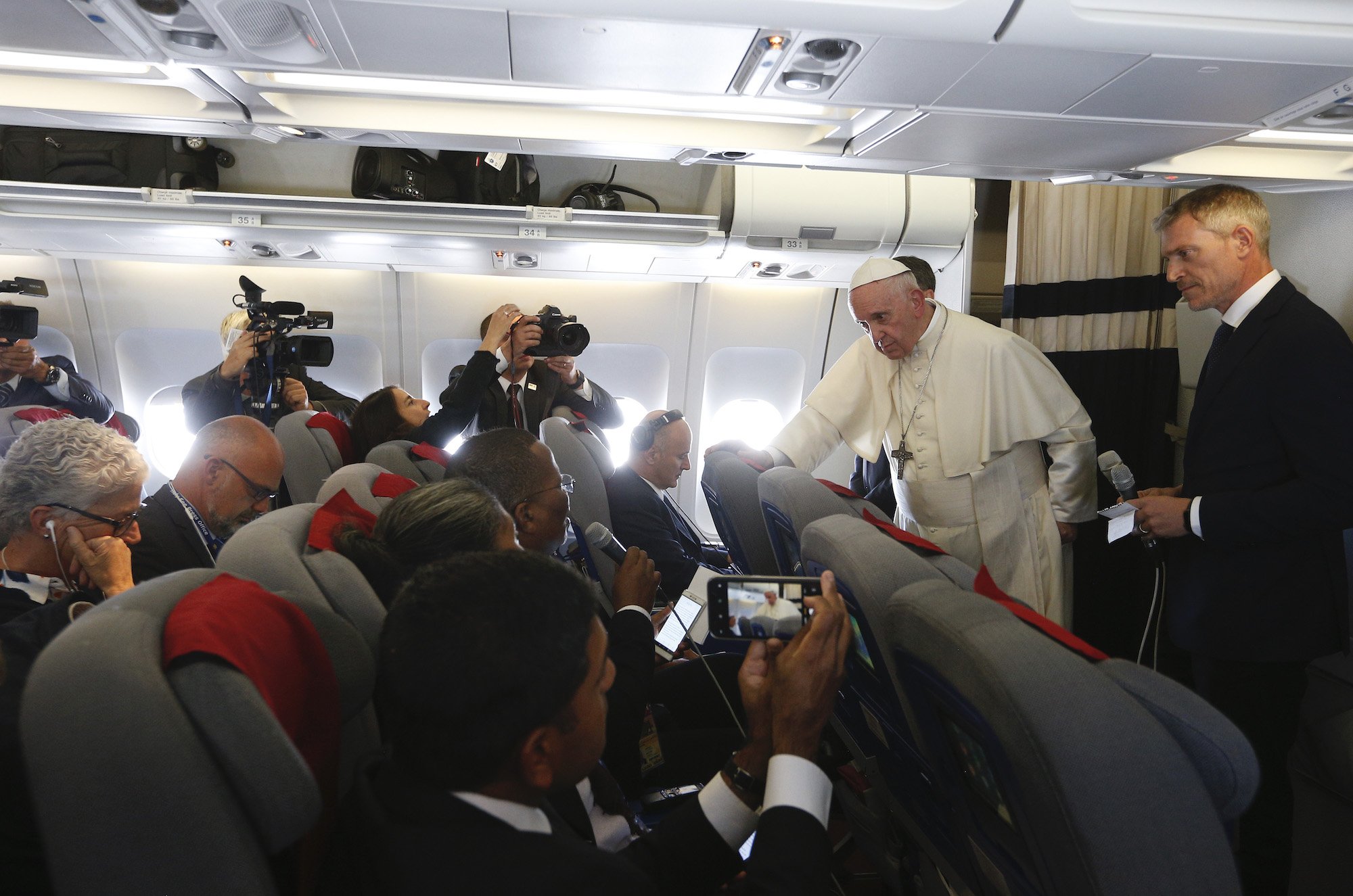 Pope Francis answers questions from journalists aboard his flight from Antananarivo, Madagascar, to Rome Sept. 10, 2019. CNS PHOTO/PAUL HARING