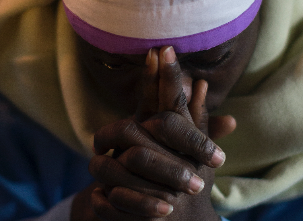 A pilgrim prays in the Church of Nativity in Bethlehem. CNS FILE PHOTO/ATEF SAFADI