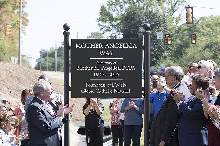 Michael Warsaw unveils the sign for Mother Angelica Way