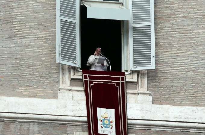Pope Francis prays the Angelus with pilgrims in St Peter's Square Jan. 10