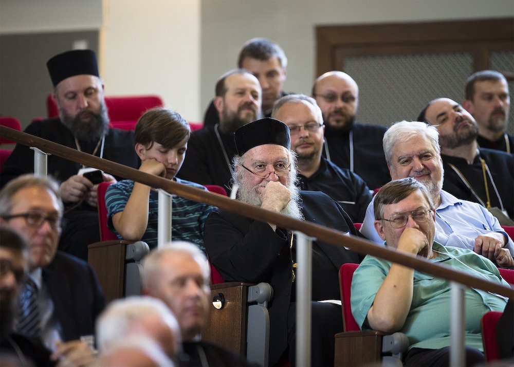 Attendees at The Catholic University of America in Washington listen to a June 6