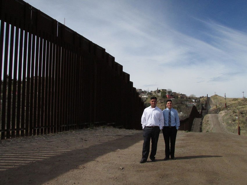 Cathedral Junior Anthony Castro and Freshman Nicholas Martin by the U.S.-Mexico wall in Nogales