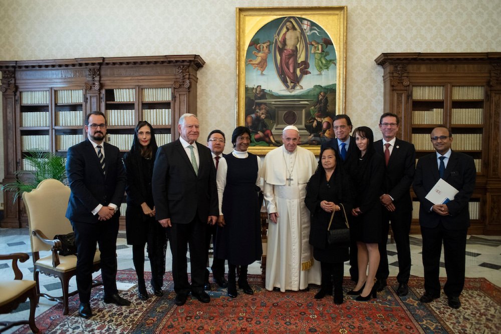 Pope Francis meets with a delegation from the International Commission Against the Death Penalty in the papal library of the apostolic palace Dec. 17. (CNS photo/Vatican Media)