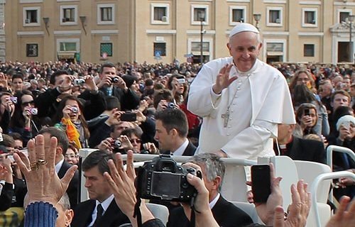 Pope Francis rides through St. Peter's Square before his Wednesday General Audience