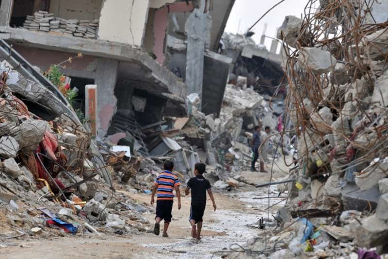 Children amid devastated buildings in Gaza. Credit: Shareef Sarhan/CRS.
