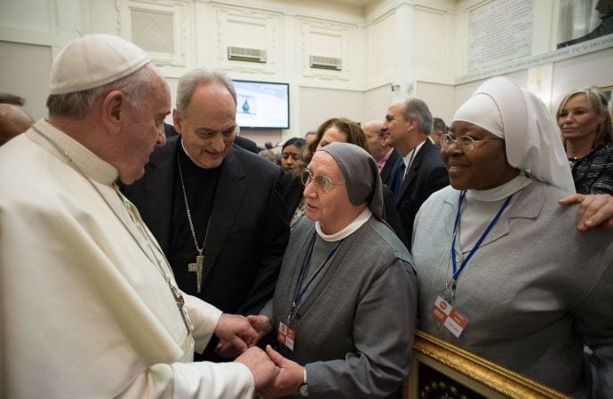 Pope Francis greets Consolata Missionary Sister Eugenia Bonetti in this Dec. 2
