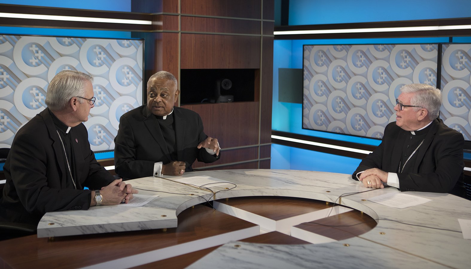 Archbishops Paul S. Coakley of Oklahoma City and Wilton D. Gregory of Washington and Bishop Frank J. Dewane of Venice, Fla., talk before a roundtable on the death penalty at the headquarters of the U.S. Conference of Catholic Bishops in Washington Oct. 10, 2019. (CNS photo/Bob Roller)